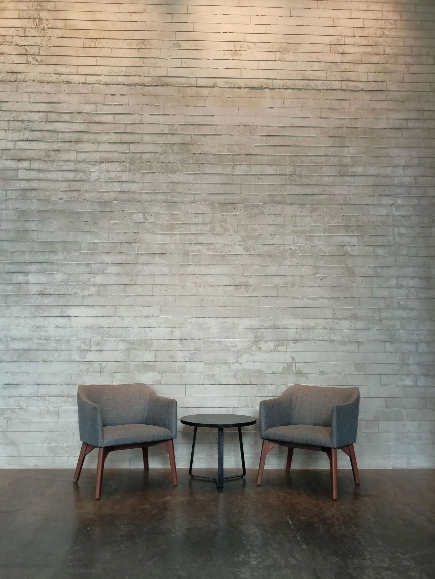 Finished interior with two armchairs and a coffee table.