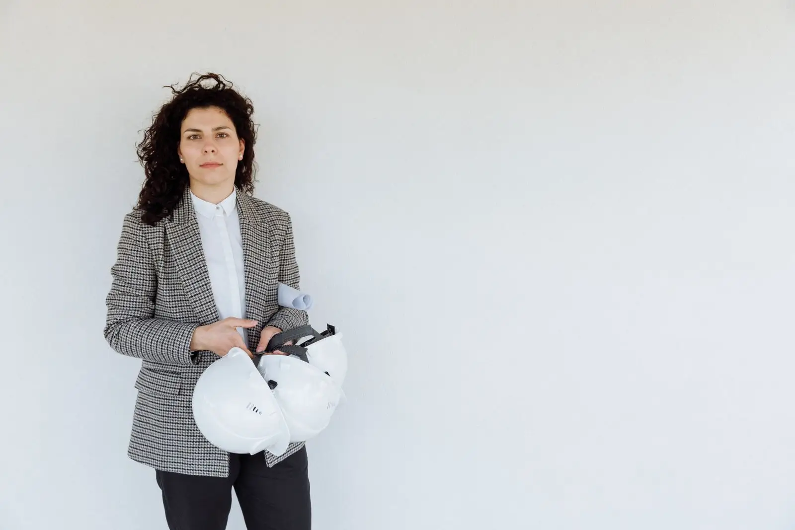 Site manager holding a hard hat.