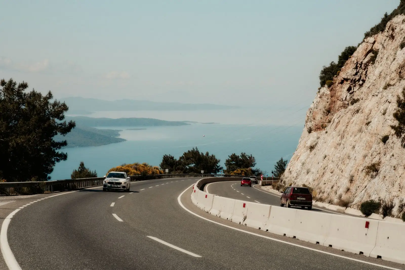 Winding coastal road above the sea.