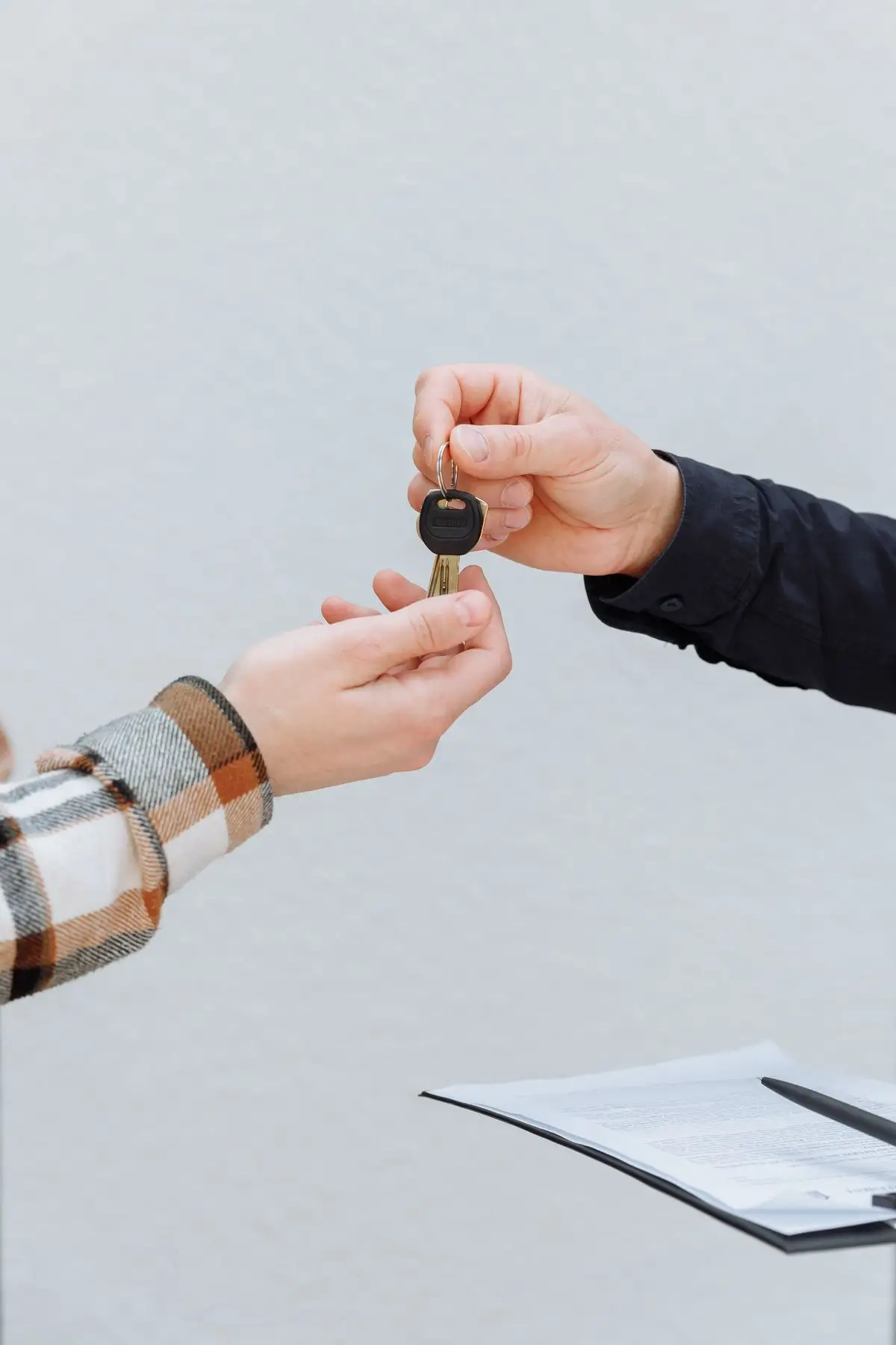 Car keys being handed over.