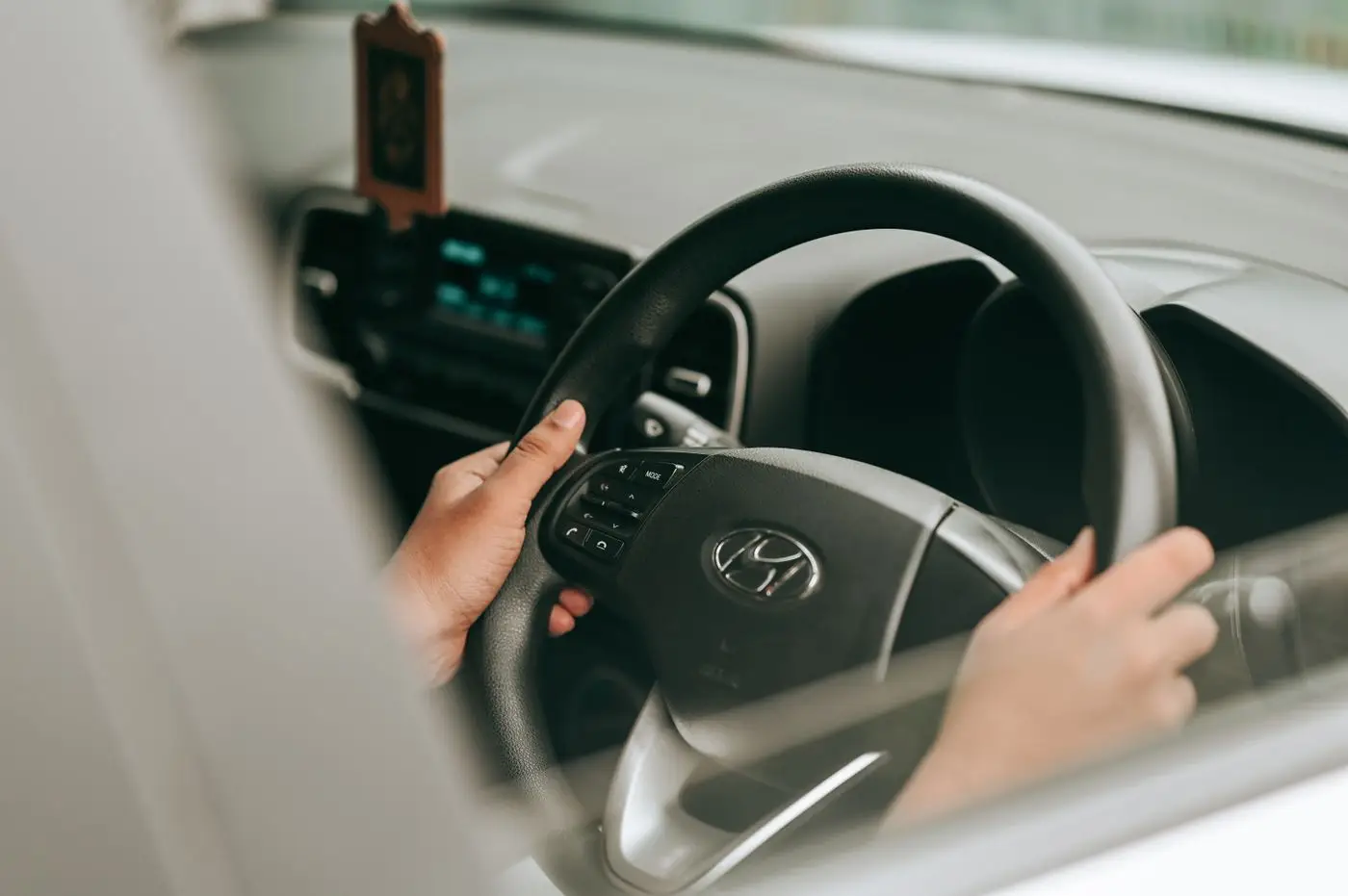 Hands on the steering wheel.