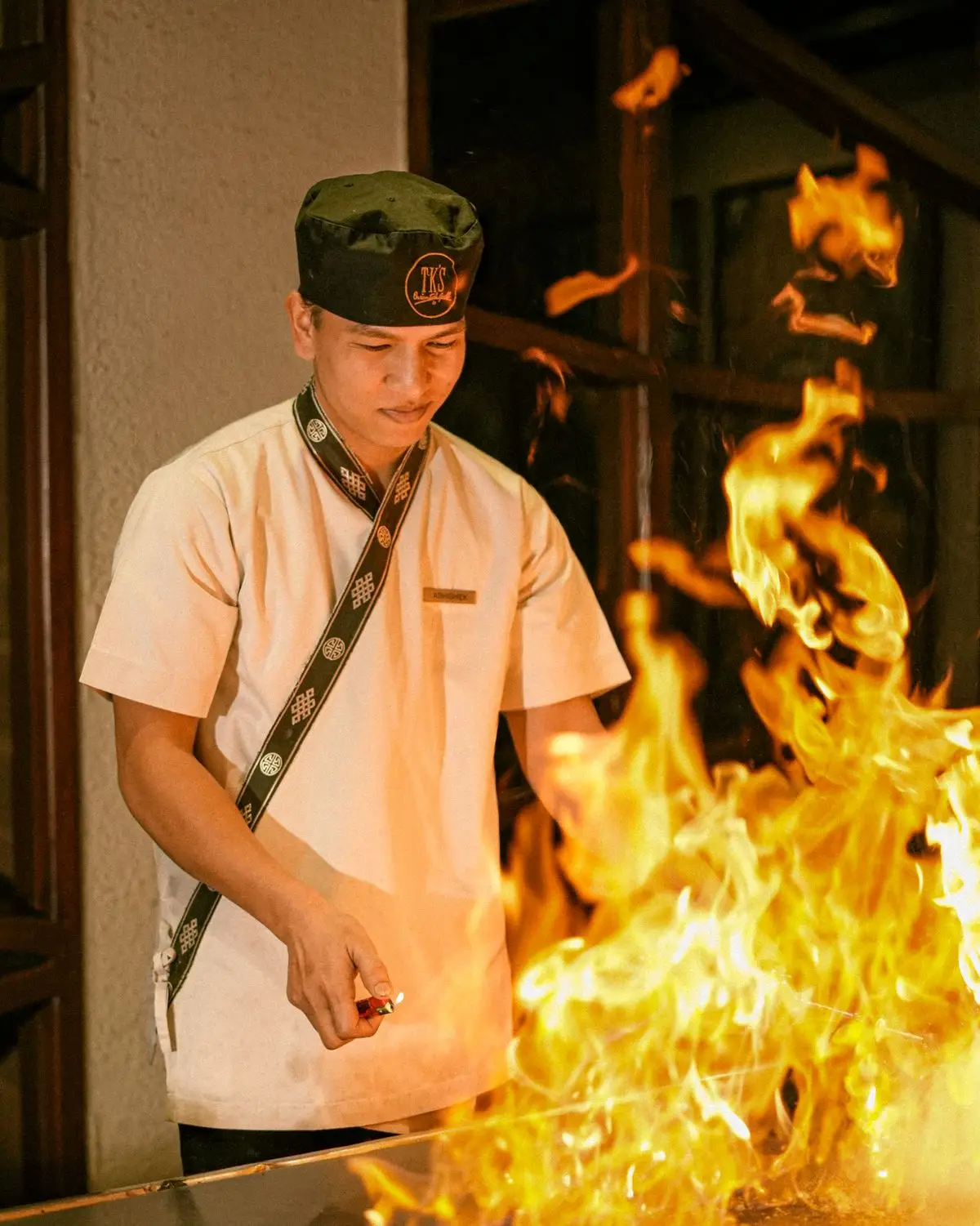 The chef working with high flames.