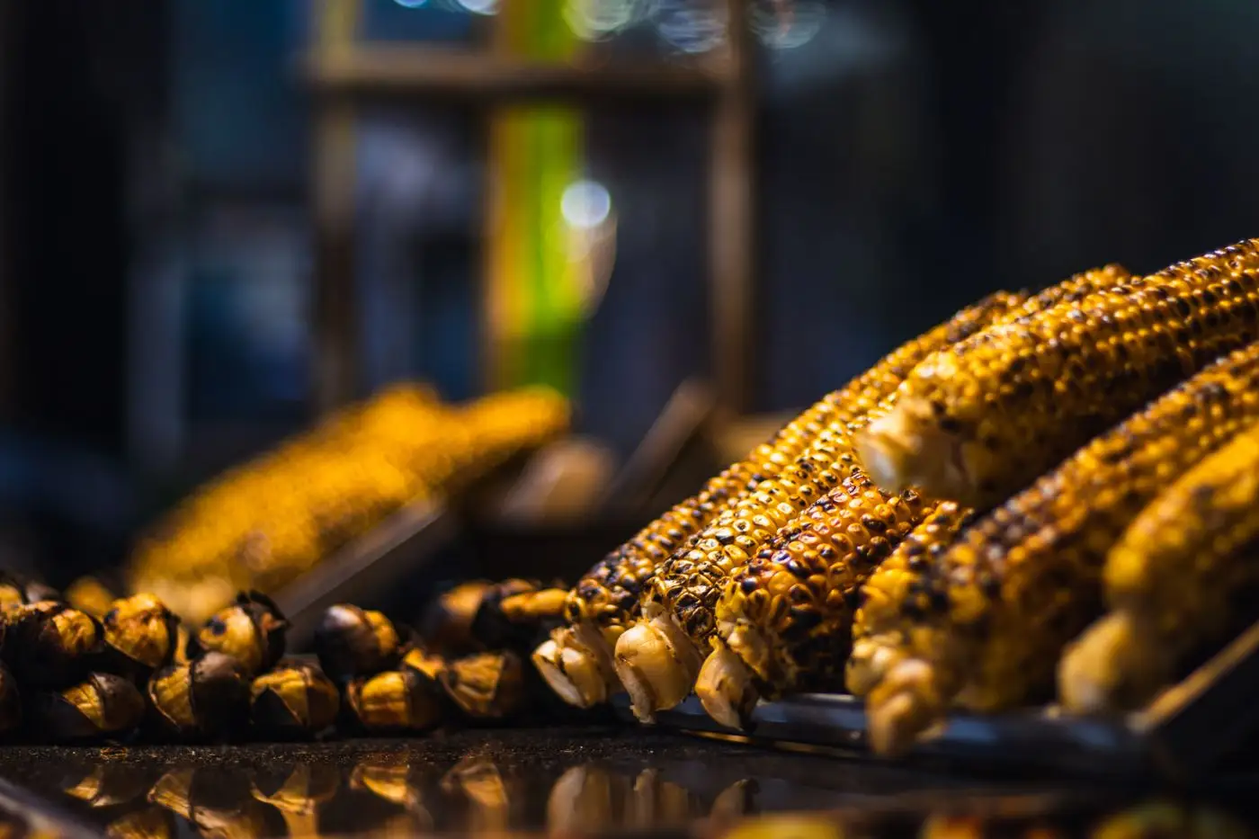 Grilled corn over the fire.